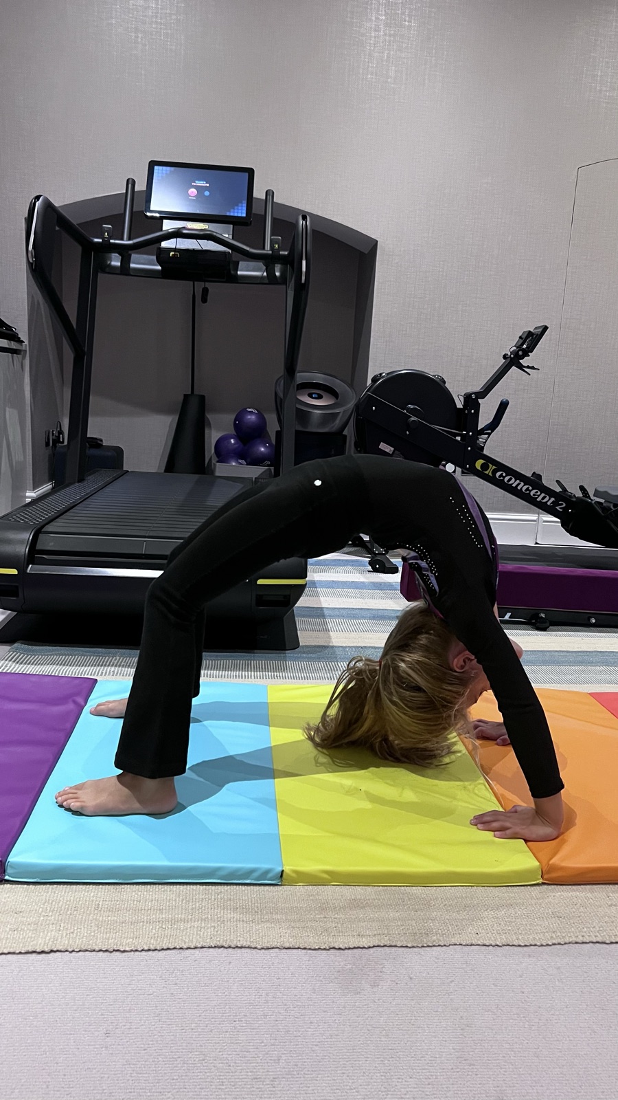 A young gymnast working on flexibility and mobility with Rosae