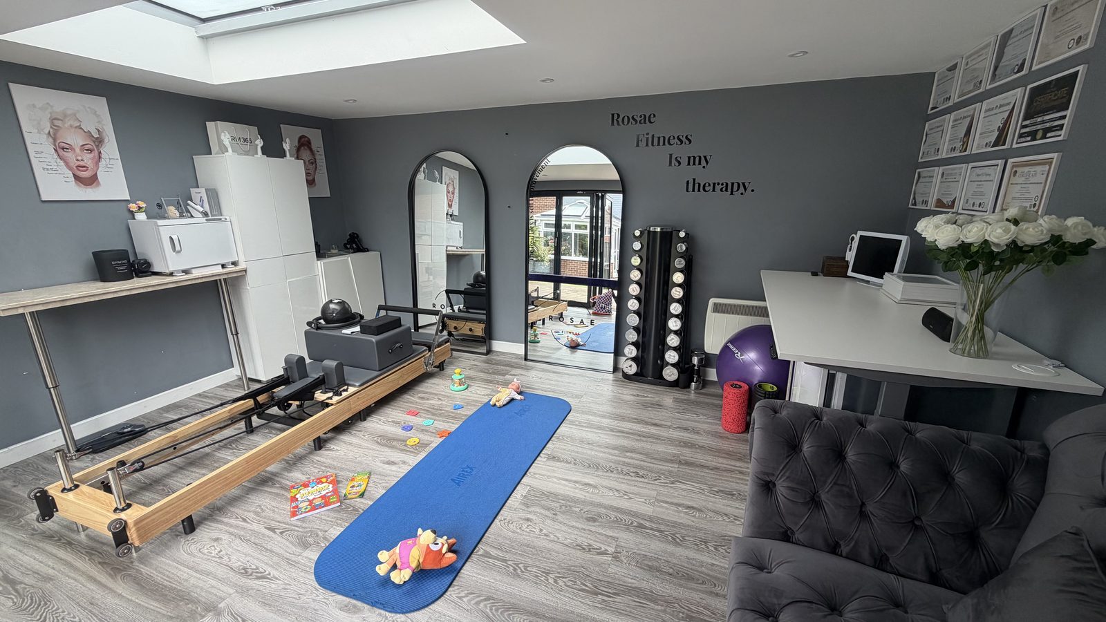 The calm, private Rosae studio set up for a mums & babies class — mats, weights and baby toys ready